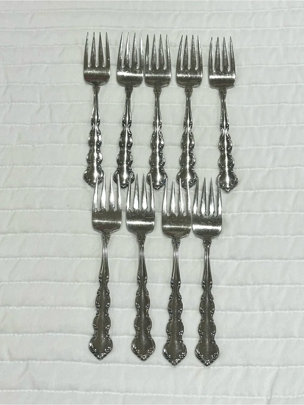 Vintage Oneida Mozart stainless salad forks.